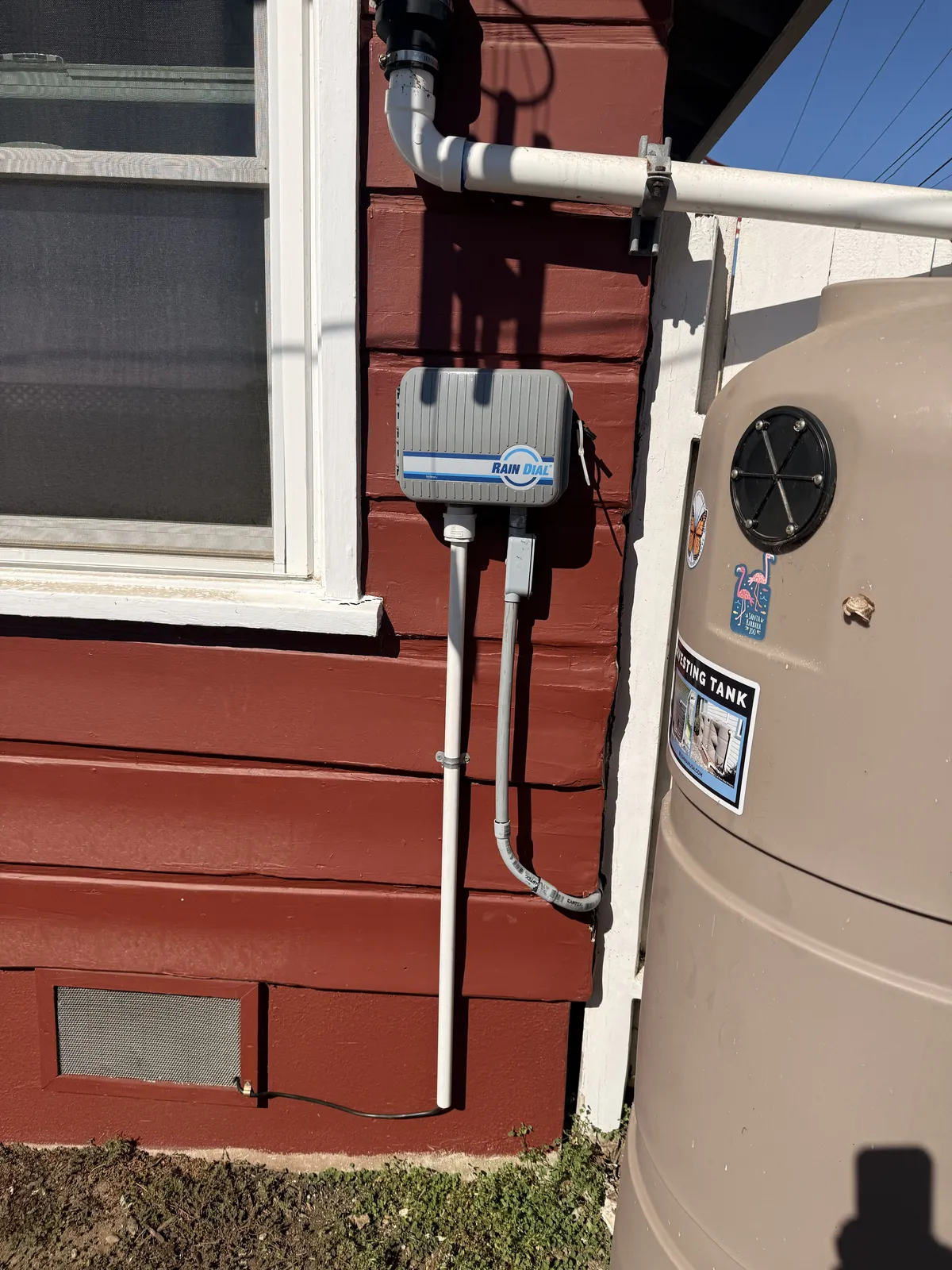 The drip timer on the wall, with its wiring run in conduit