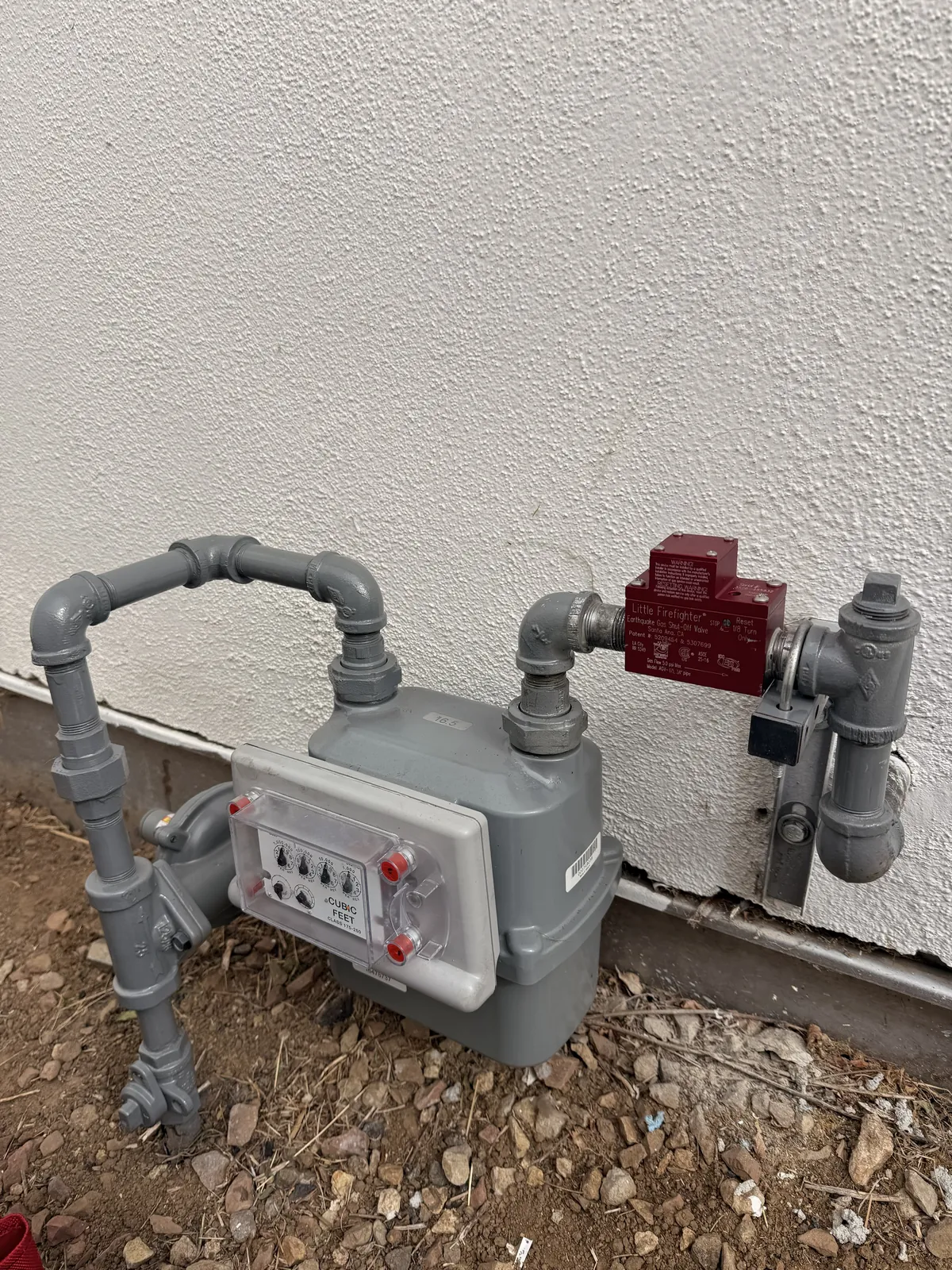 The red earthquake shutoff valve installed at the gas meter