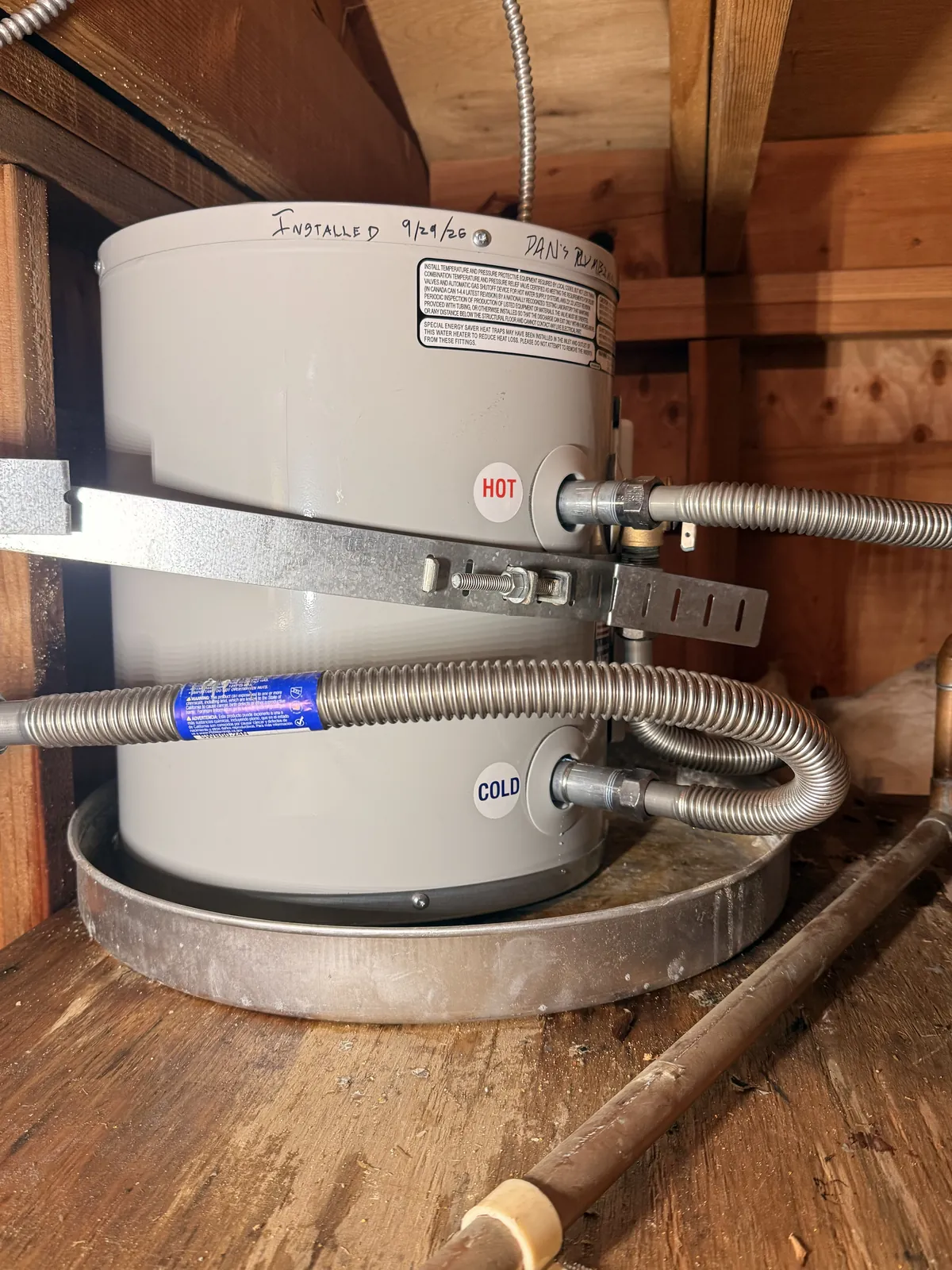 The new six-gallon electric heater, strapped, with new flexible connections