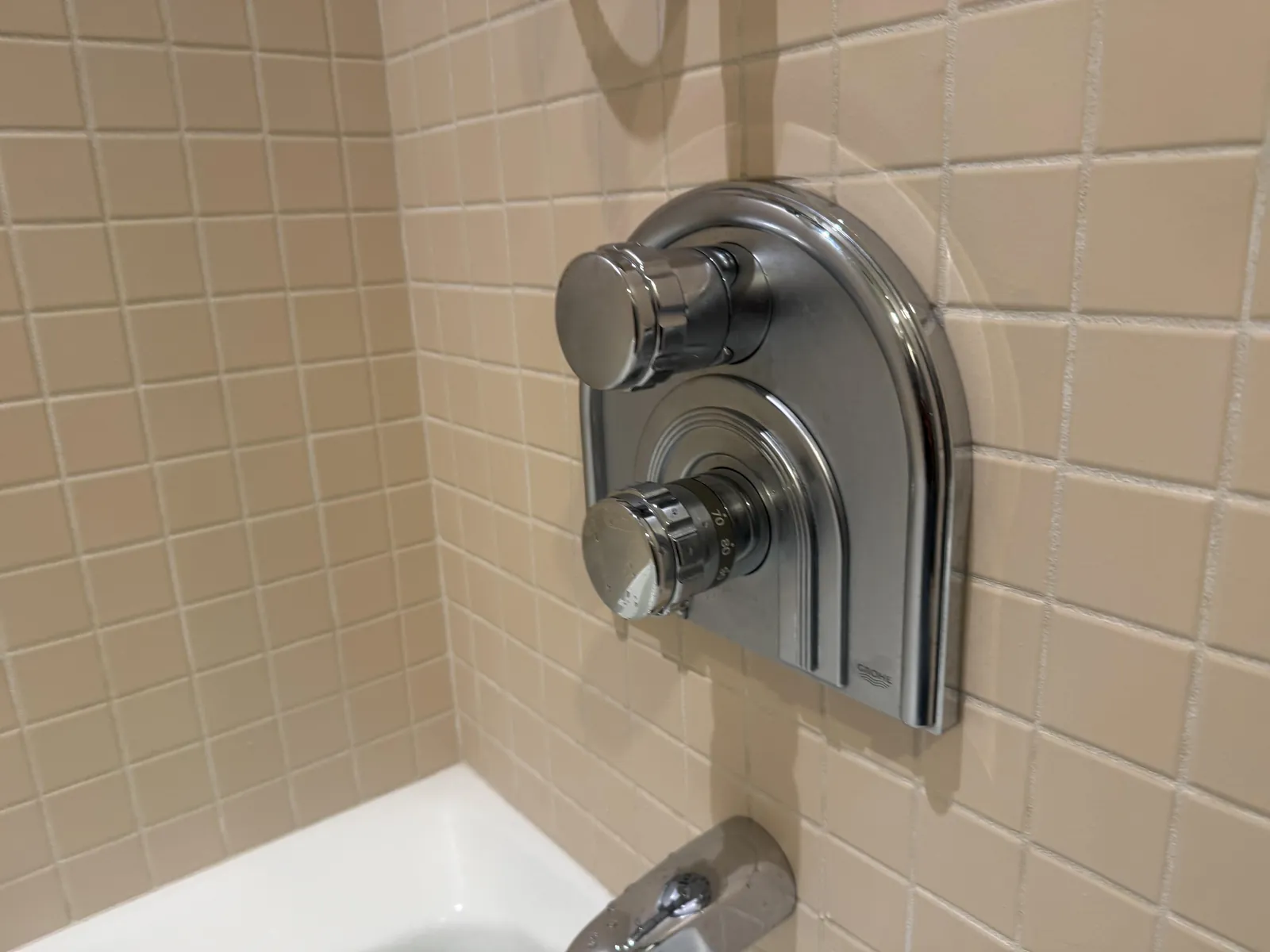The Grohe shower valve trim back on after the new thermostatic valve went in