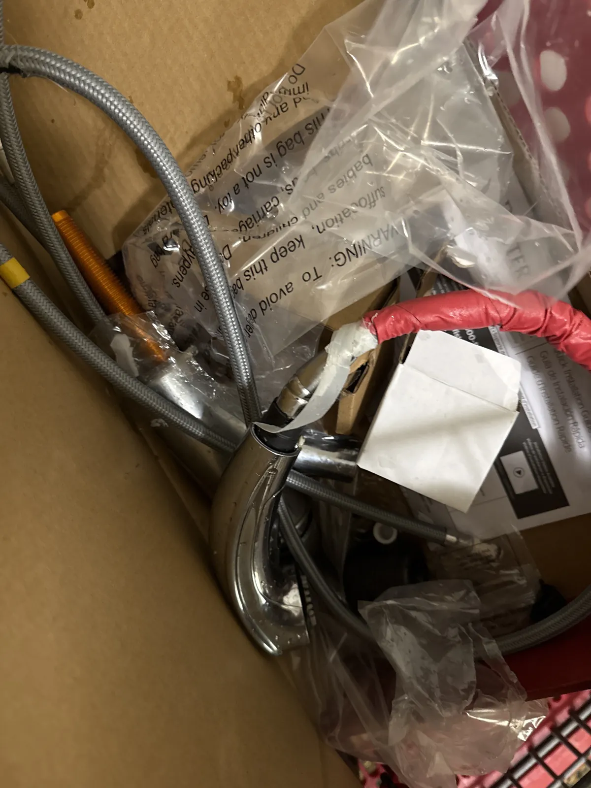 The new pull-down faucet and its parts, ready to go in