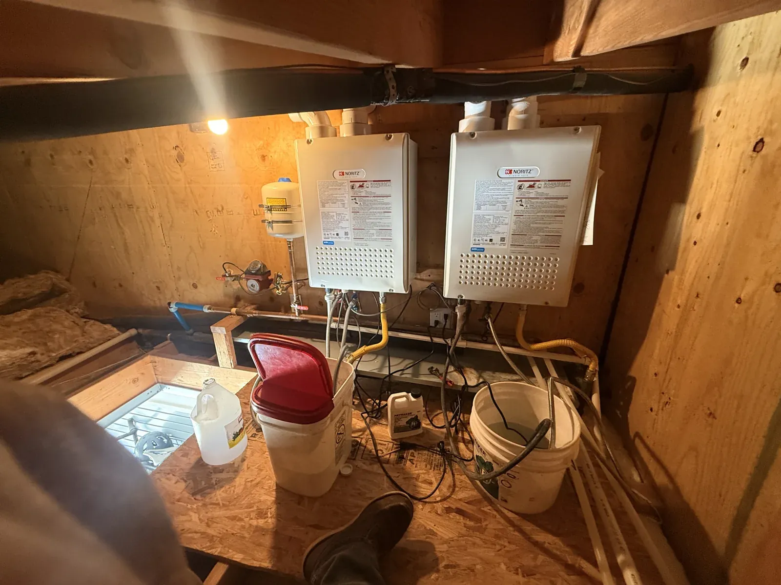 Two tankless water heaters set up for descaling service