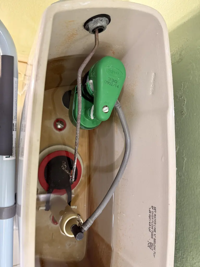The new bidet seat that had been pushing against the toilet tank