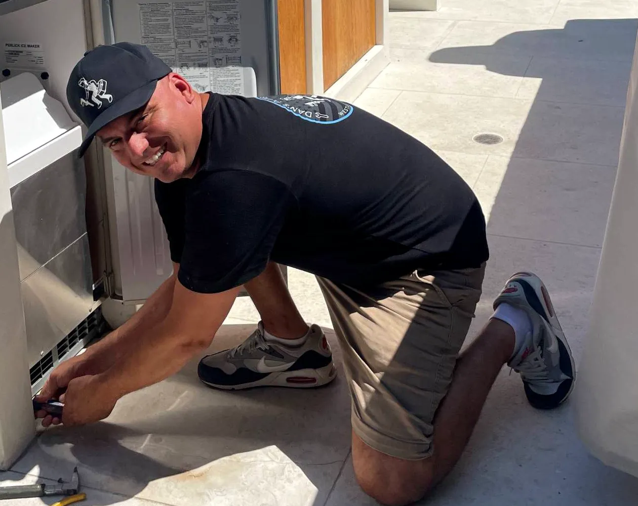 Dan fitting an ice maker into an outdoor kitchen.